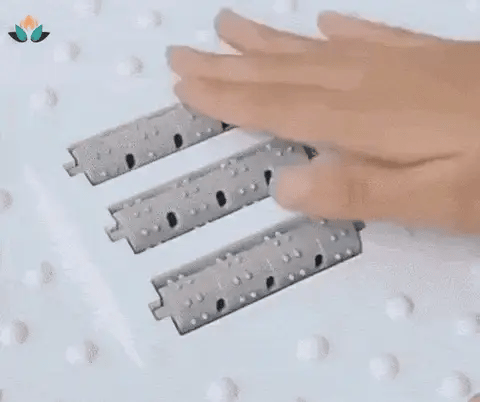 Apoio para os pés ergonómico com massagem